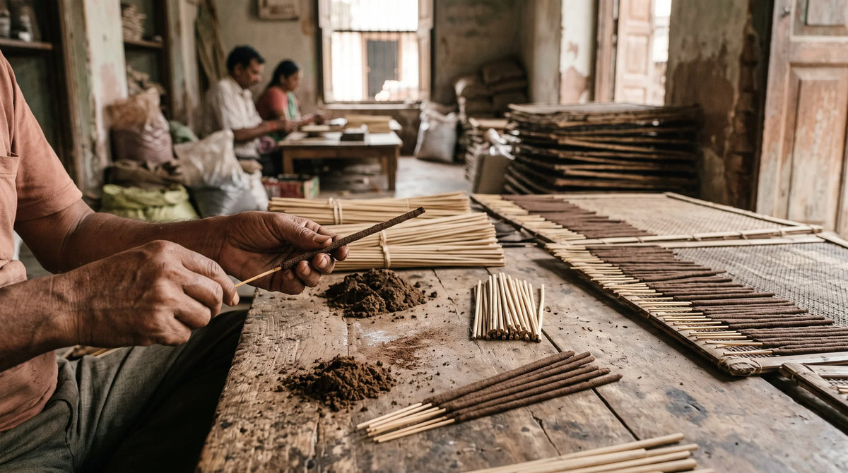 Traditional incense stick manufacturing process showing artisans handcrafting agarbatti using bamboo sticks and natural incense powder.