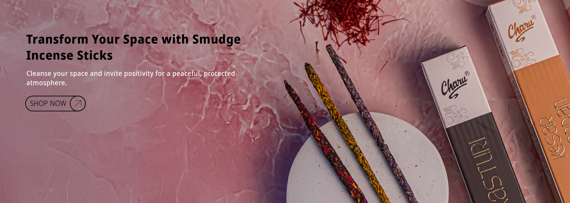 Charu Smudge Incense Sticks with Kesar and Kasturi fragrances displayed on a textured pink background.